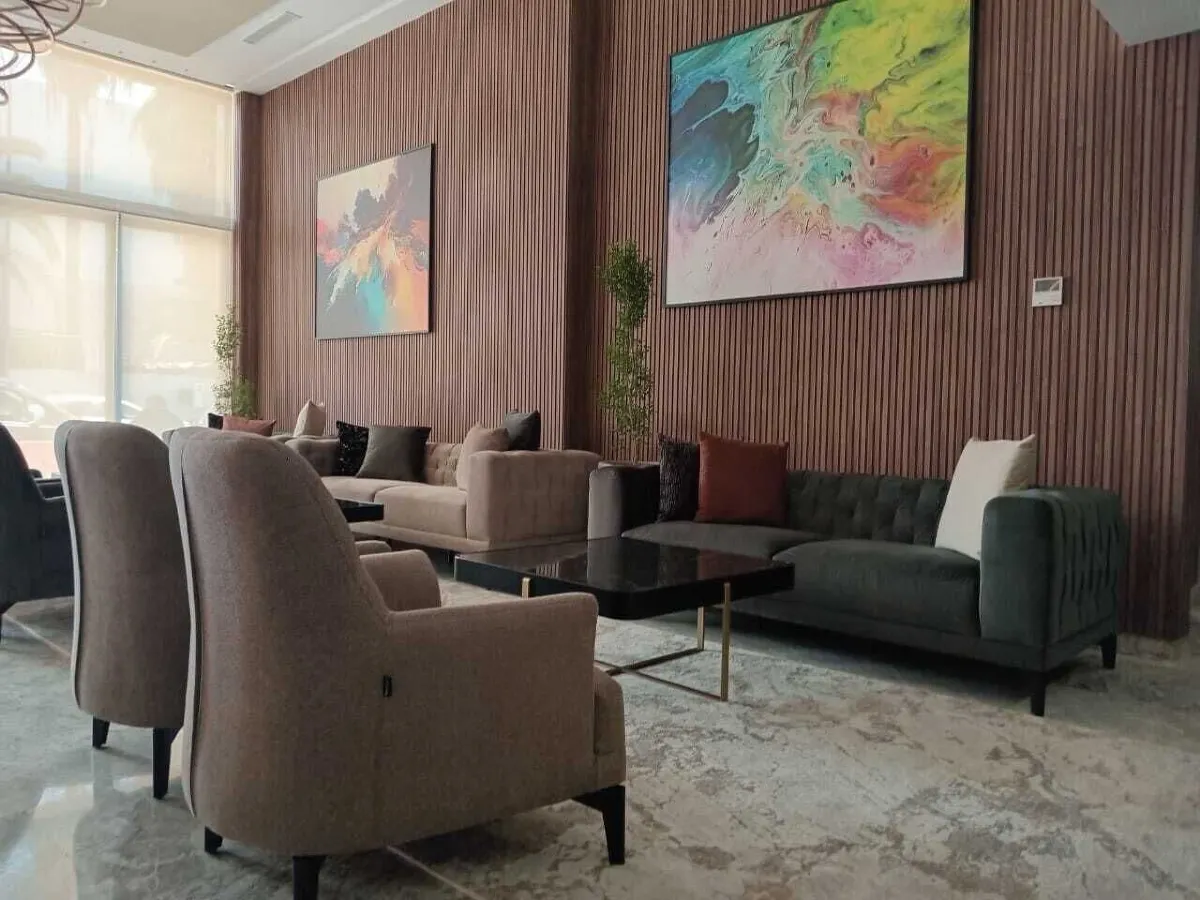Hotel lobby lounge with sofas and abstract artwork